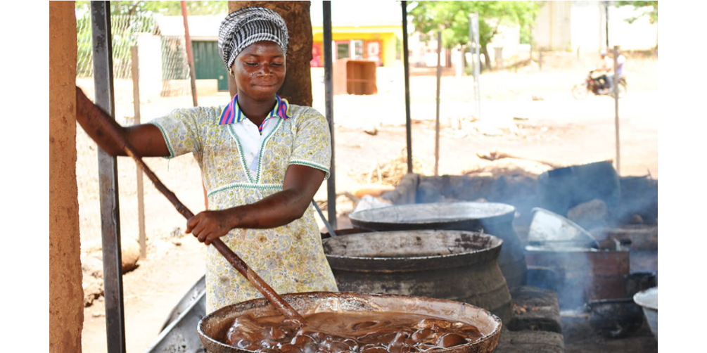 woman making shea butter